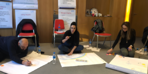Professionals collaborating during a time management workshop to develop prioritisation, planning, and decision-making skills 