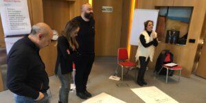 Team members participating in a workshop focused on effective communication skills and leadership.