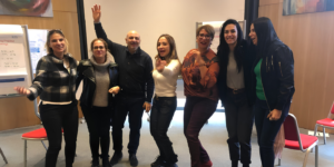Colleagues celebrating together during a workshop on self-awareness and leadership in the workplace. 