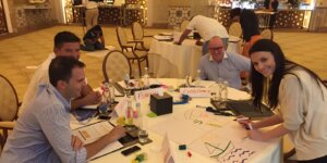Team members collaborating on an activity during a leadership workshop