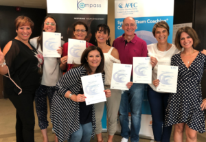 Attendees receiving and presenting their certificates after completing skills development training.