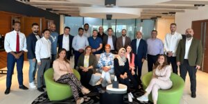 Participants posing together after the first day of a leadership and coaching programme