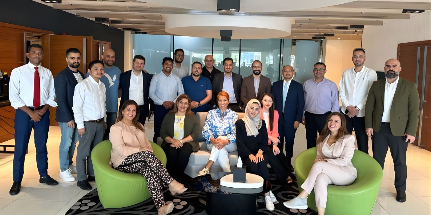 Participants posing together after the first day of a leadership and coaching programme