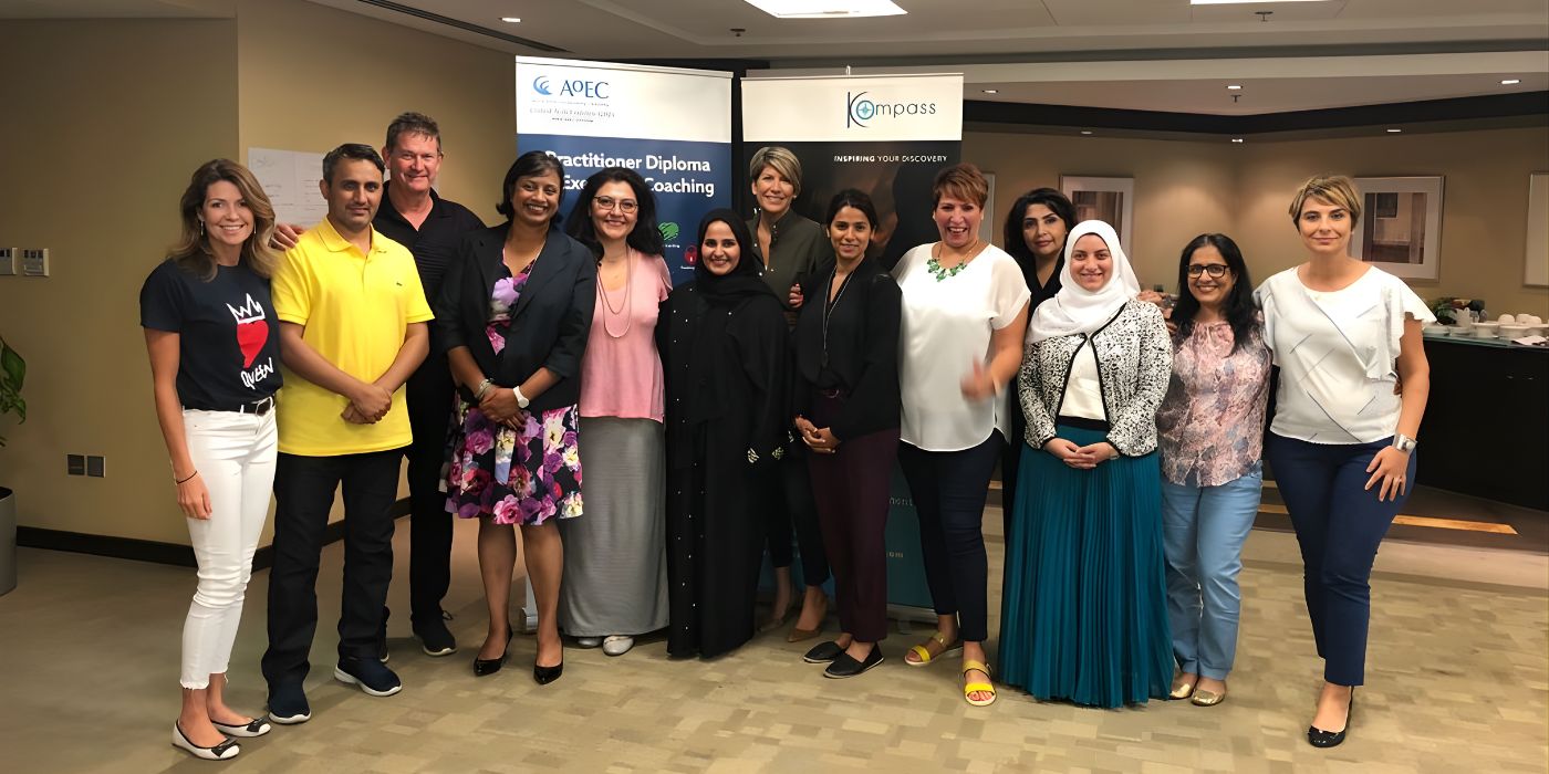 Attendees and coaches following a leadership training and executive coaching session in a professional setting