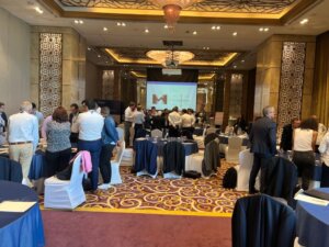 Participants networking during an executive coaching seminar in a conference setting