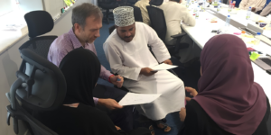 Team professionals representing situational leadership and adaptive workplace collaboration in a modern office setting 